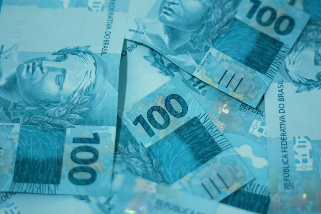 a pile of ten hundred dollar bills sitting on top of each other a pile of ten hundred dollar bills sitting on top of each other
