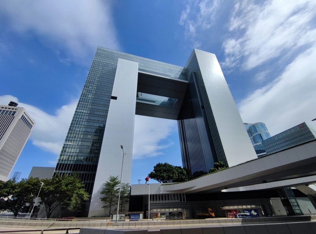 a very tall building sitting in the middle of a city a very tall building sitting in the middle of a city