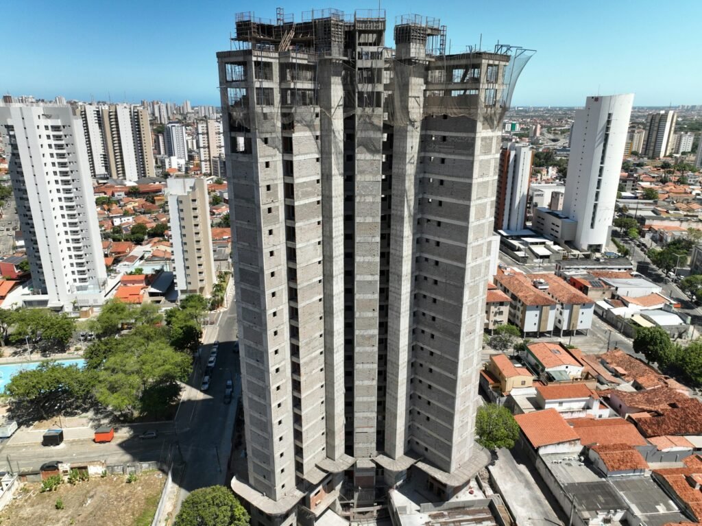 a very tall building with a lot of windows a very tall building with a lot of windows